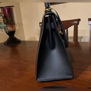 Absolutely stunning rare brand  new purse with handle .A must!